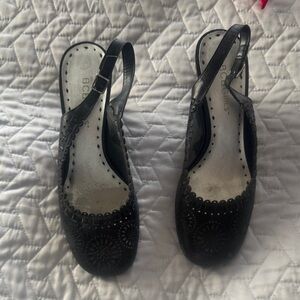 BCBGirls Black wedges for Women. Embossed leather